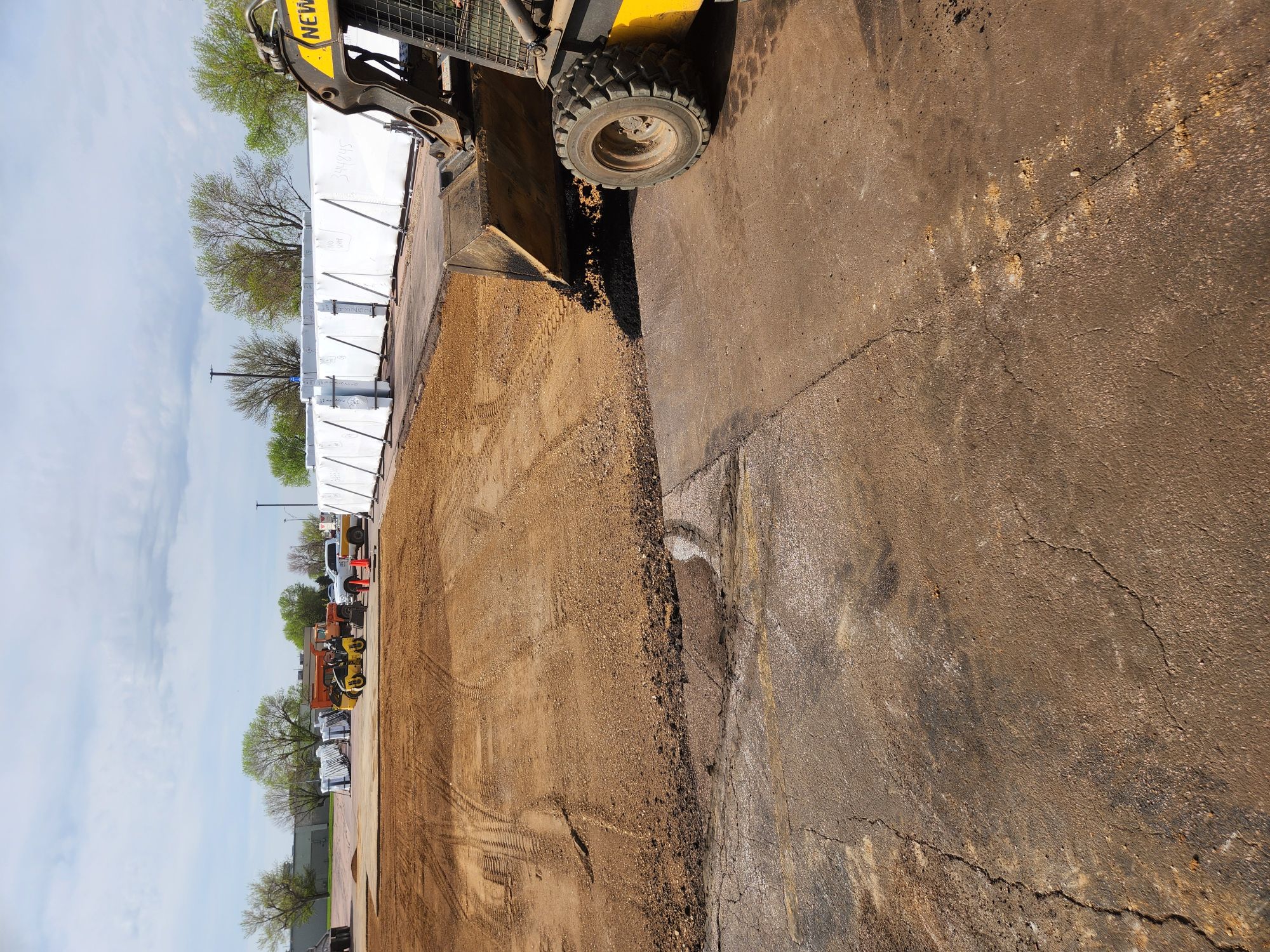 Milling machine grinding asphalt surface